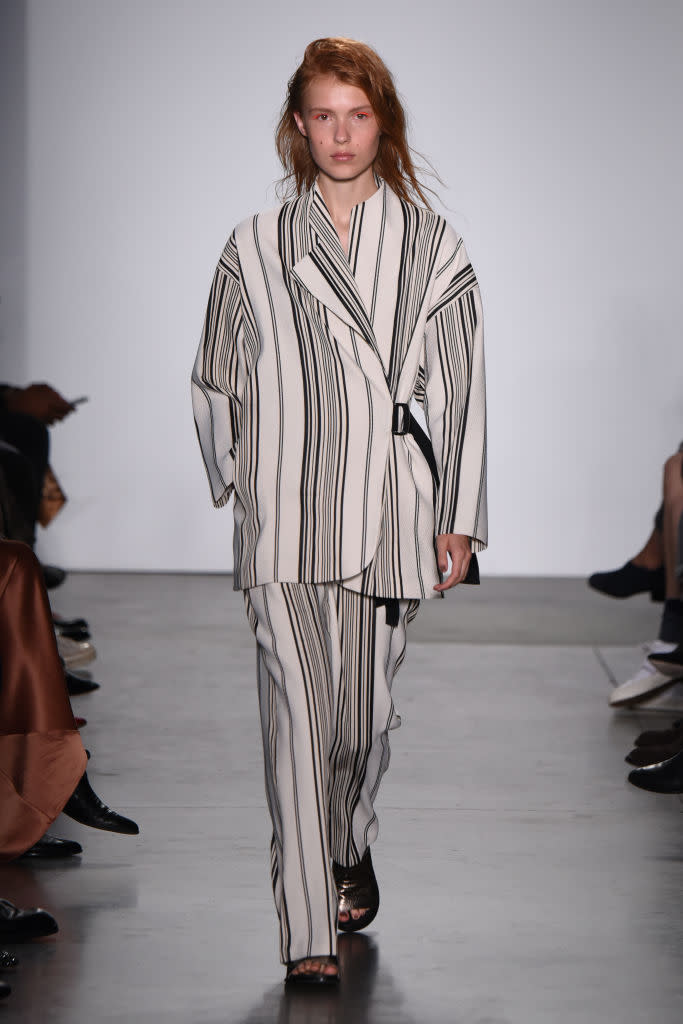 <p>A model wears striped, side-wrap pantsuit at the Zero + Maria Cornejo spring 2019 show during New York Fashion Week at Pier 59. (Photo: Albert Urso/Getty Images) </p>
