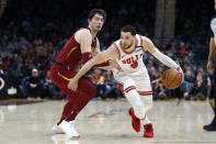 Chicago Bulls' Zach LaVine (8) drives against Cleveland Cavaliers' Cedi Osman in the second half of an NBA basketball game, Saturday, Jan. 25, 2020, in Cleveland. (AP Photo/Ron Schwane)