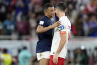 France’s Kylian Mbappe, left, and Poland's Robert Lewandowski talk after the World Cup round of 16 soccer match between France and Poland, at the Al Thumama Stadium in Doha, Qatar, Sunday, Dec. 4, 2022. France won 3-1. (AP Photo/Natacha Pisarenko)