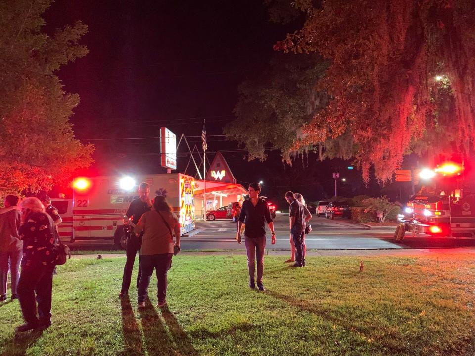 A Tallahassee Democrat reporter captured these photos of the scene shortly after a pedestrian was hit by a vehicle that fled.