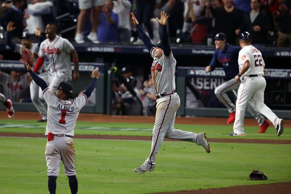 HOUSTON, TEXAS - NOVEMBER 02:  Austin Riley #27 of the Atlanta Braves celebrates with teammates after their 7-0 victory against the Houston Astros in Game Six to win the 2021 World Series at Minute Maid Park on November 02, 2021 in Houston, Texas. (Photo by Tom Pennington/Getty Images)