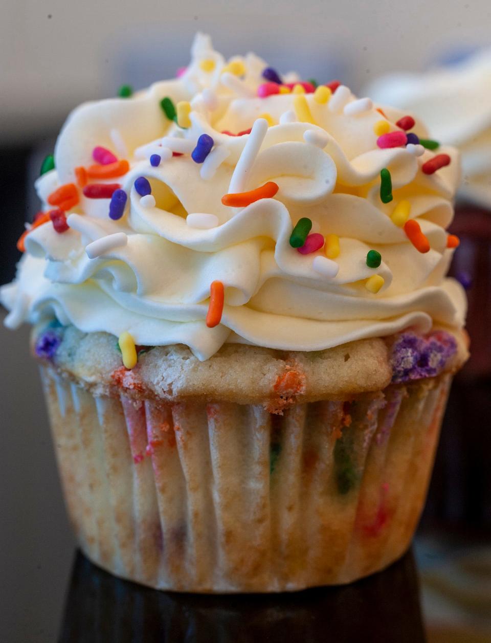 At Maine Girl Cupcakes in Natick,  a "funfetti" cupcake: a vanilla cupcake baked with rainbow sprinkles, topped with vanilla buttercream and rainbow sprinkles, Dec. 14, 2022.