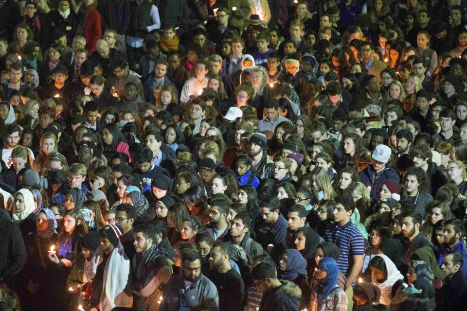 Students gather during a vigil on the campus of the University of North Carolina, for the three young Muslims who were killed in Chapel Hill