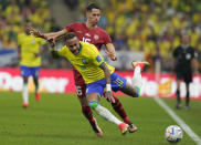 Brazil's Neymar, front, and Serbia's Sasa Lukic battle for the ball during the World Cup group G soccer match between Brazil and Serbia, at the Lusail Stadium in Lusail, Qatar, Thursday, Nov. 24, 2022. (AP Photo/Themba Hadebe)