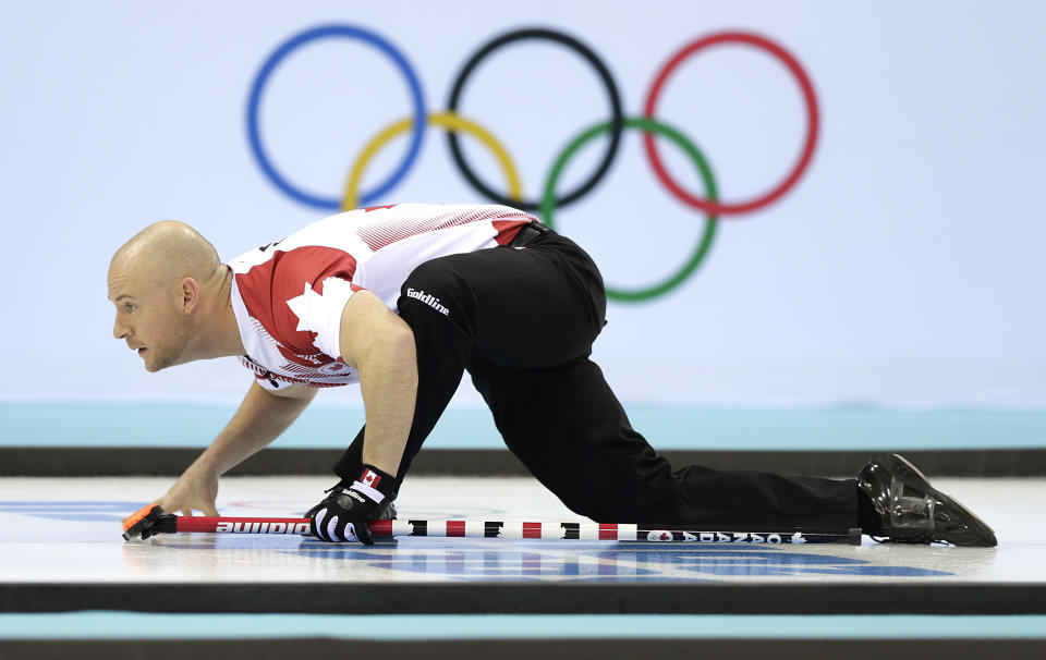 Canada's Ryan Fry watches the rock during the men's curling competition at the 2014 Winter Olympics, Monday, Feb. 10, 2014, in Sochi, Russia. (AP Photo/Wong Maye-E)