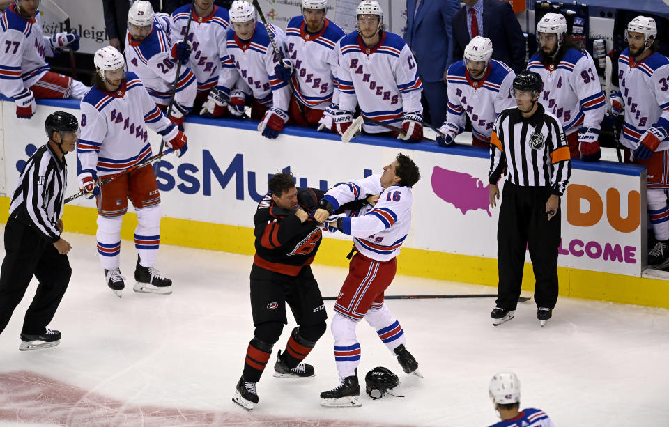 New York Rangers' Ryan Strome (16) fights with Carolina Hurricanes' Justin Williams during the first period in the NHL hockey Stanley Cup playoffs in Toronto, Saturday, Aug. 1, 2020. (Frank Gunn/The Canadian Press via AP)