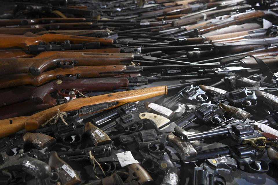Weapons collected as part of an amnesty are displayed in a warehouse near the city of Smederevo, Serbia, Sunday, May 14, 2023. Serbian authorities on Sunday displayed some of around 13,500 weapons they say have been collected since last week's mass shootings, including automatic weapons, hand bombs and anti-tank grenades. (Serbian Presidential Press Service via AP)