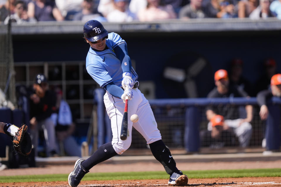 Tampa Bay Rays Yu Chang hits a solo home run in the second inning of a spring training baseball game against the Detroit Tigers in Port Charlotte, Fla., Sunday, Feb. 25, 2024. (AP Photo/Gerald Herbert)