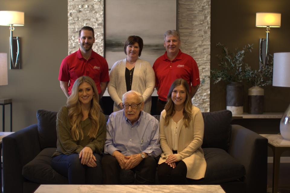 Three generations of the Steger family sit for a photograph. Steger’s Furniture, based in Pekin, has been family-owned and operated for 86 years.