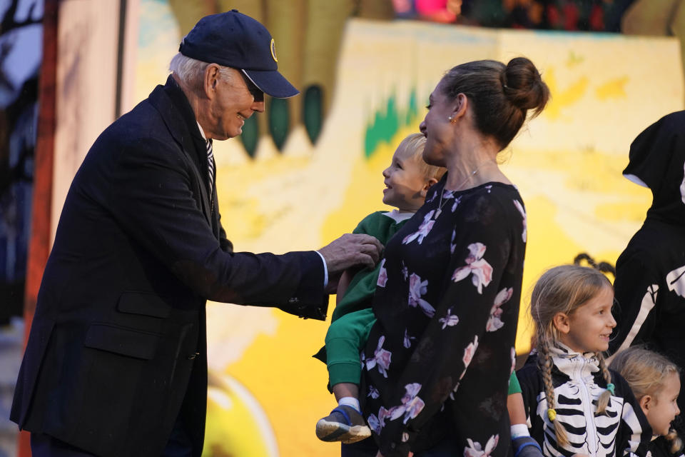 President Joe Biden gives treats to trick-or-treaters on the South Lawn of the White House, on Halloween, Monday, Oct. 30, 2023. (AP Photo/Andrew Harnik)