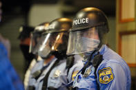 Philadelphia police stand in position during a march by protesters Tuesday Oct. 27, 2020 in Philadelphia. Hundreds of demonstrators marched in West Philadelphia over the death of Walter Wallace, a Black man who was killed by police in Philadelphia on Monday. Police shot and killed the 27-year-old on a Philadelphia street after yelling at him to drop his knife. (AP Photo/Matt Slocum)