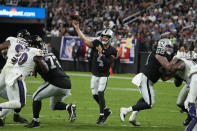 Las Vegas Raiders quarterback Derek Carr (4) throws against the Baltimore Ravens during the first half of an NFL football game, Monday, Sept. 13, 2021, in Las Vegas. (AP Photo/Rick Scuteri)