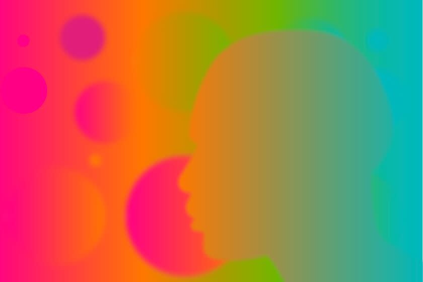 A profile silhouette of a face in a bright gradient of colors in front of a spectral background of colors and soft shapes.