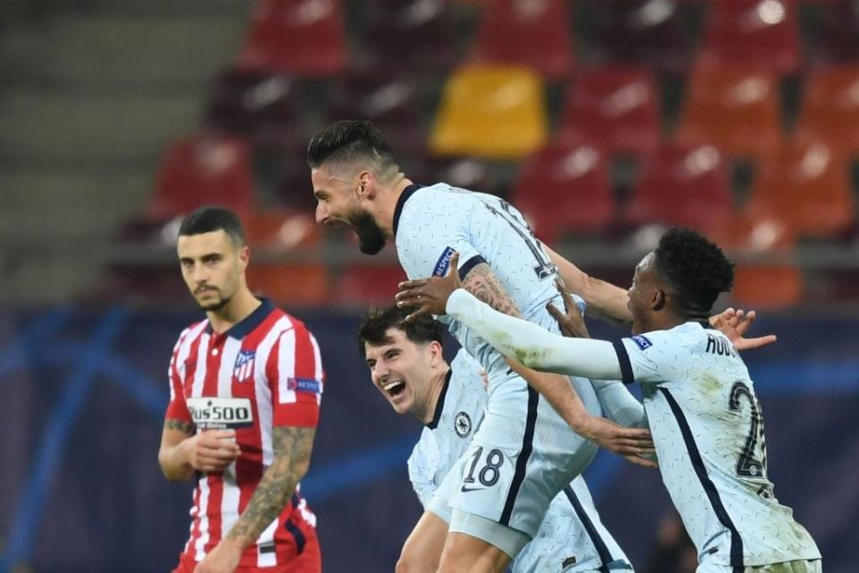 Giroud celebrates after finding a way through Atletico’s defenceAFP via Getty Images