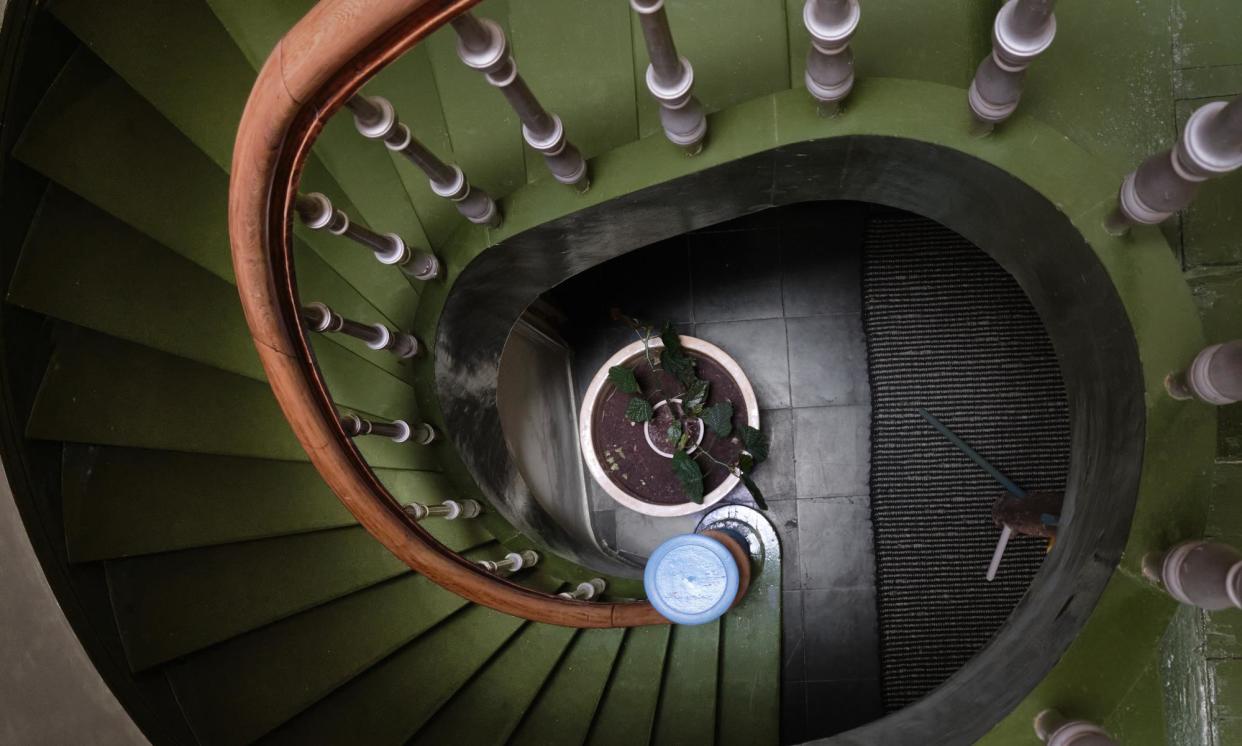 <span>The only way is up: an emerald-green central staircase fills the house with light.</span><span>Photograph: Mr Frank/Living inside</span>