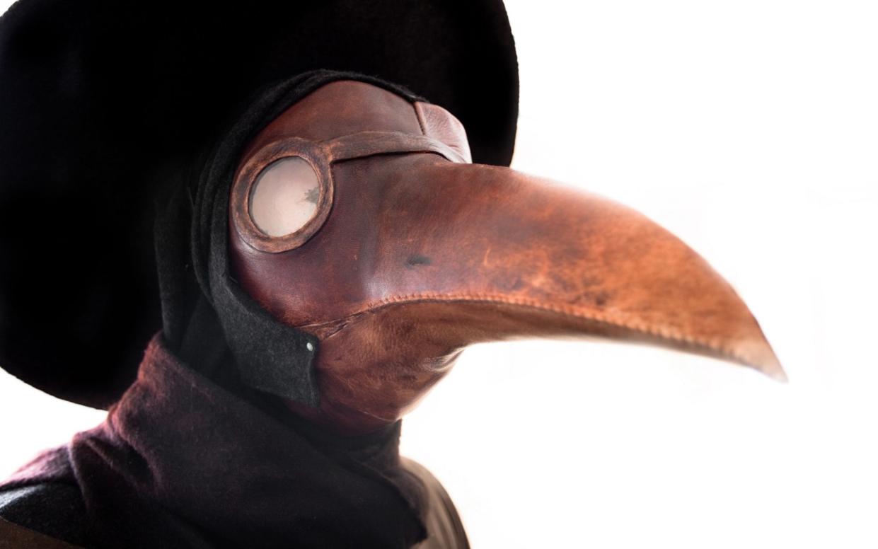 The world's population is to shrink for the first time since the 14th century when doctors wore bird-like masks to ward off the plague