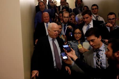 Senator John McCain (R-AZ) speaks with reporters after voting against the "skinny repeal" health care bill on Capitol Hill in Washington, U.S., July 28, 2017. REUTERS/Aaron P. Bernstein