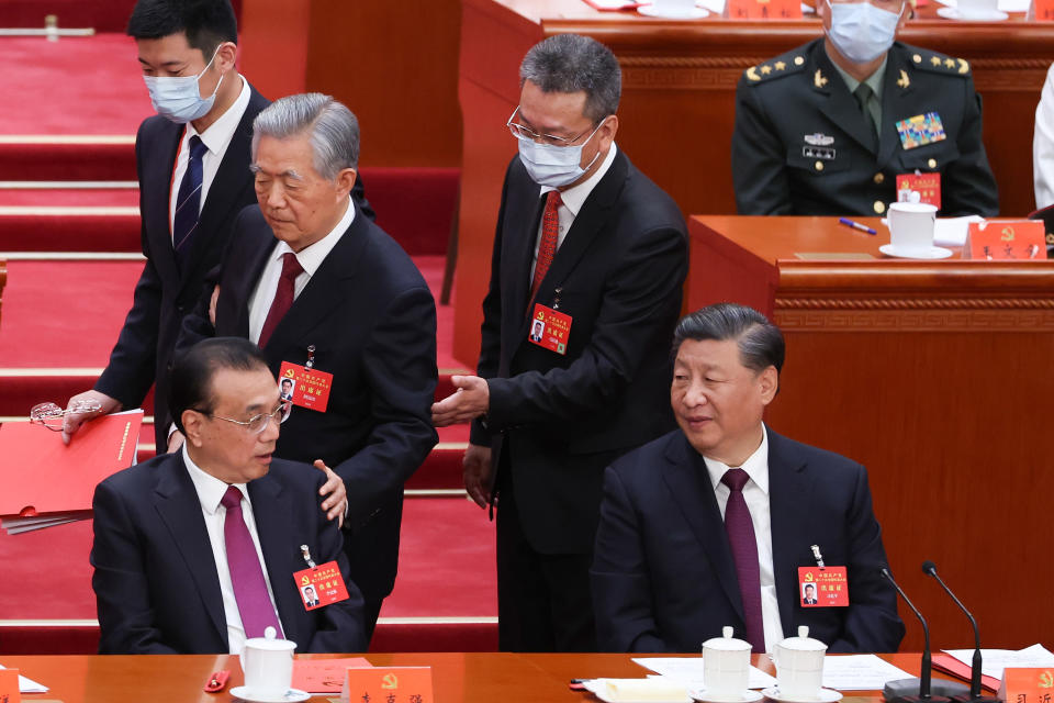 BEIJING, CHINA - OCTOBER 22: (L-R) Chinese Premier Li Keqiang, former President Hu Jintao and President Xi Jinping attend the closing ceremony of the 20th National Congress of the Communist Party of China (CPC) at the Great Hall of the People on October 22, 2022 in Beijing, China. China's Communist Party Congress is concluding today with incumbent President Xi Jinping expected to seal a third term in power. (Photo by Lintao Zhang/Getty Images)