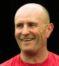 FILE - Referee Mills Lane smiles during undercard weigh-ins for the Evander Holyfield-Mike Tyson boxing bout in Las Vegas, on June 27, 1997. Lane, the Hall of Fame boxing referee who was the third man in the ring when Tyson bit Holyfield’s ear, died Tuesday, Dec. 6, 2022. He was 85. Lane had suffered a stroke in 2002 and son Tommy said his father had taken a significant turn for the worse recently before entering hospice care on Friday. (AP Photo/Jack Dempsey, File)