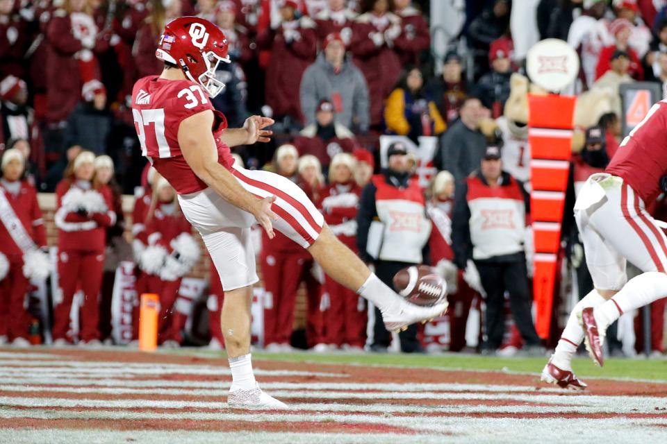 Oklahoma's Michael Turk (37) punts during a Bedlam college football game between the University of Oklahoma Sooners (OU) and the Oklahoma State University Cowboys (OSU) at Gaylord Family-Oklahoma Memorial Stadium in Norman, Okla., Saturday, Nov. 19, 2022. Oklahoma won 28-13.