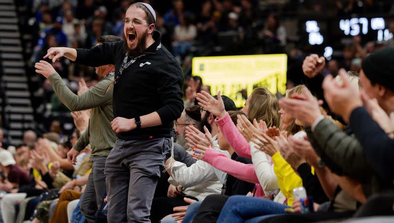 Jazz fans cheer during the fourth quarter of the NBA basketball game between the Utah Jazz and the Dallas Mavericks at the Delta Center in Salt Lake City on Monday, Jan. 1, 2024. The Jazz won the game 127-90.