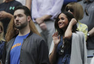Meghan, Duchess of Sussex, right, and Alexis Ohanian, left, wait for the start of the women's singles final of the U.S. Open tennis championships between Serena Williams, of the United States, and Bianca Andreescu, of Canada, Saturday, Sept. 7, 2019, in New York. (AP Photo/Charles Krupa)