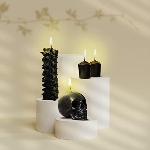 <p><strong>GAVIA</strong></p><p>amazon.com</p><p><strong>$37.95</strong></p><p>Want an elegantly spooky, all-inclusive set that hits all the right notes? This black, creepy-chic bundle features a spine candle, a skull candle, and two black votives, so you've pretty much got all you need to goth up your living room in one go.</p>