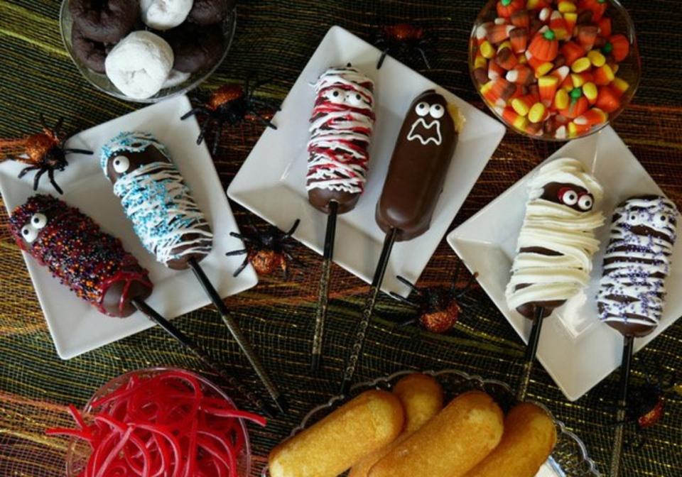 <p>George Duran</p><p>Hostess Twinkies are dipped in chocolate, then striped with white icing and two candy eyeballs to create a platter of fun mummies.</p><p><strong>Get the recipe: <a href="https://parade.com/1083973/parade/frozen-twinkie-pop-mummies-recipe/" rel="nofollow noopener" target="_blank" data-ylk="slk:Frozen Twinkie Pop Mummies;elm:context_link;itc:0;sec:content-canvas" class="link ">Frozen Twinkie Pop Mummies</a></strong></p>