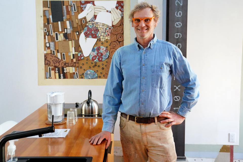 Artist and owner Mark de Jong of an Airbnb rental property known as the Swing House, featuring a large swing hung from the ceiling. The house is located in the industrial neighborhood of Camp Washington in Cincinnati, pictured, Thursday, Dec. 2, 2021. The Italianate, three-story home built in 1880 has been converted into one massive, wide-open room.