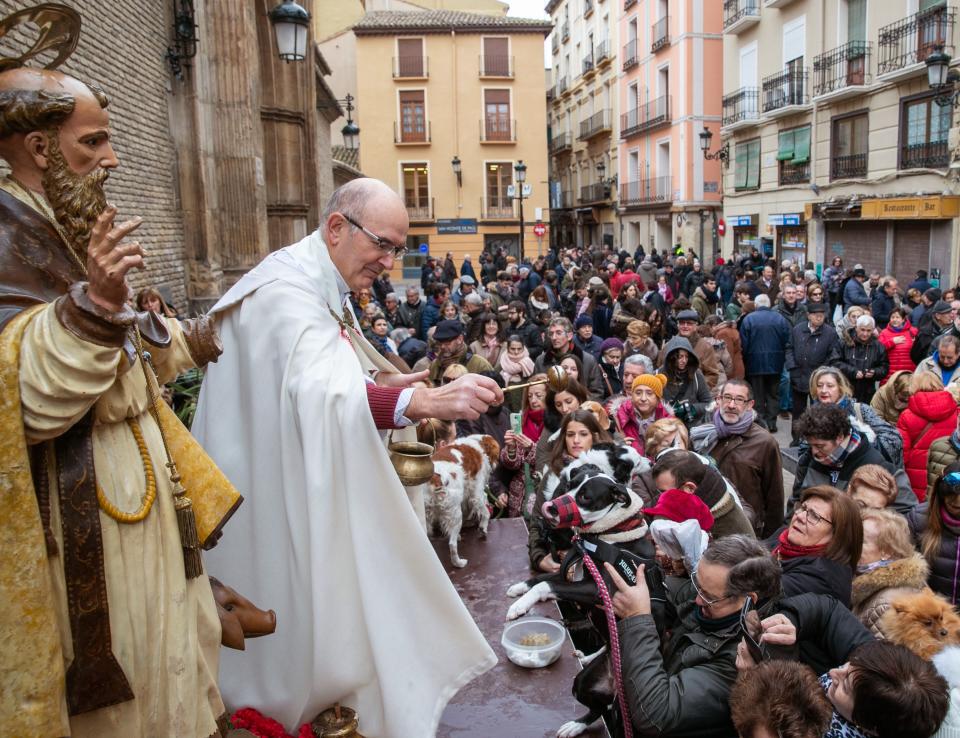 A priest blesses a dog in Zaragoza, Spain, Jan. 17, 2019. (Photo: Javier Cebollada/EPA-EFE/REX/Shutterstock)