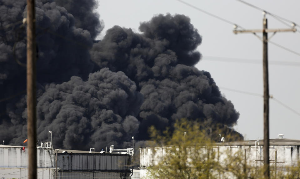 The petrochemical fire at Intercontinental Terminals Company reignited as crews tried to clean out the chemicals that remained in the tanks, Friday, March 22, 2019, in Deer Park, Texas. The efforts to clean up a Texas industrial plant that burned for several days this week were hamstrung Friday by a briefly reignited fire and a breach that led to chemicals spilling into the nearby Houston Ship Channel. (Godofredo A. Vasquez/Houston Chronicle via AP)