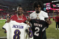 Baltimore Ravens quarterback Lamar Jackson, right, and Arizona Cardinals wide receiver Marquise Brown, left, swap jerseys after an NFL preseason football game, Sunday, Aug. 21, 2022, in Glendale, Ariz. The Ravens defeated the Cardinals 24-17. (AP Photo/Rick Scuteri)