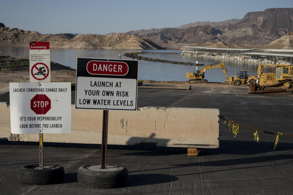 Signs indicate that a boat ramp is closed due to low water levels in Lake Mead near Las Vegas, Nevada, on June 10, 2021, where the water level has fallen to its lowest since the reservoir was filled in the 1930s. (Photo by Bridget BENNETT / AFP) (Photo by BRIDGET BENNETT/AFP via Getty Images)