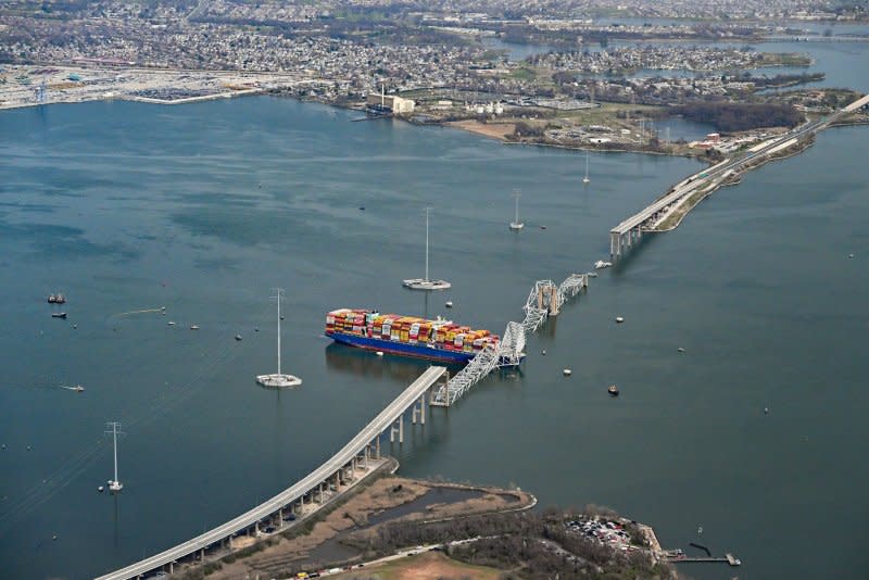 The damaged container ship rests in the Patapsco River after crashing into and destroying the Francis Scott Key Bridge at the entrance to Baltimore harbor in Baltimore on Tuesday. Photo by David Tulis/UPI