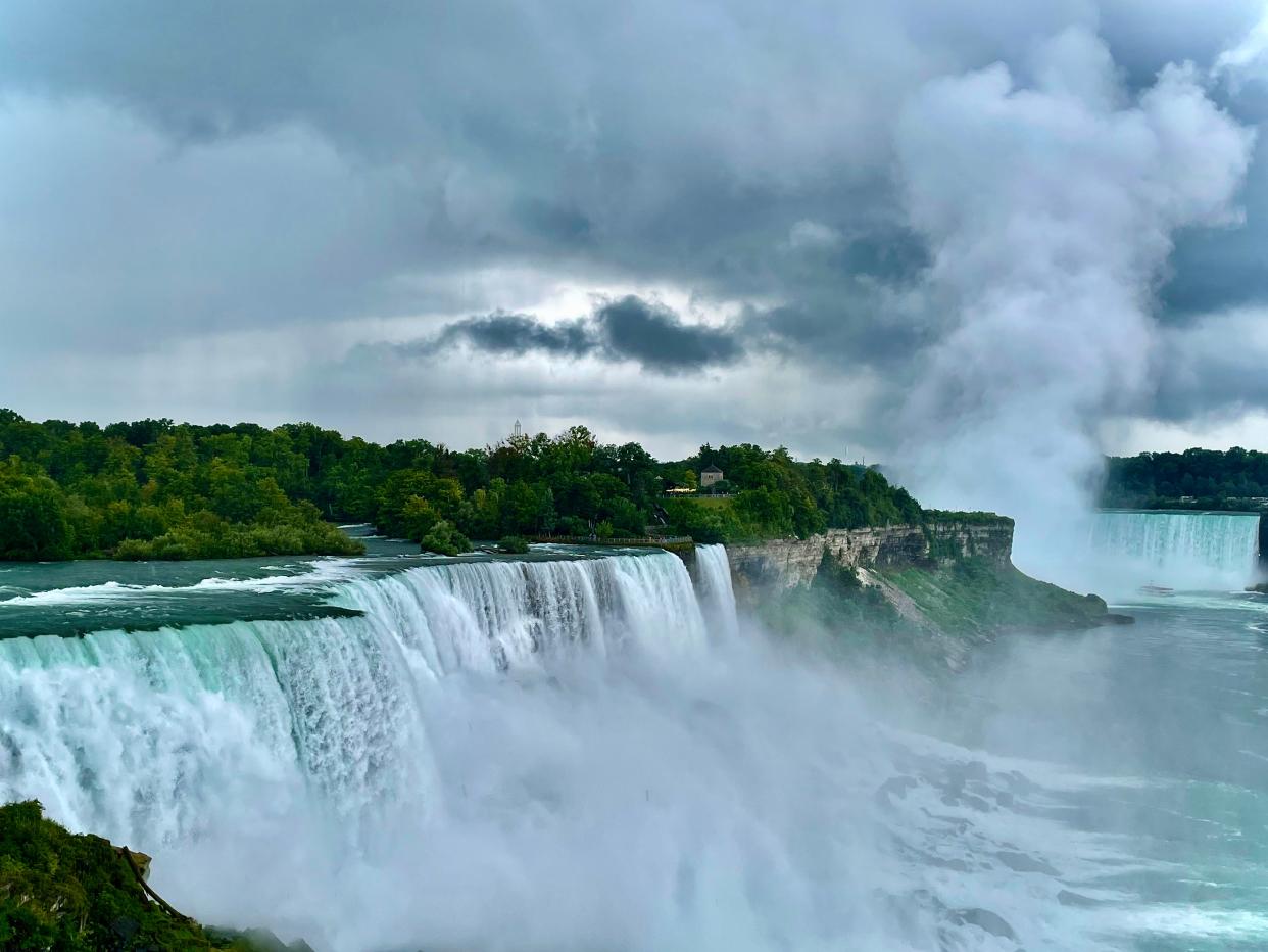 The awesome power of the cascading water creates a marvel where river meets mist meets cloud.