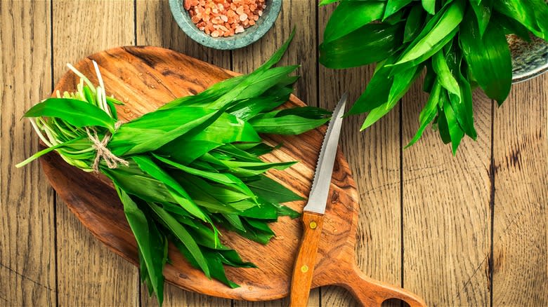 Fresh bundled ramps on cutting board 