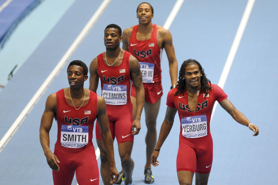 United States' Calvin Smith, Kyle Clemons, Kind Butler III and David Verburg, from left, smile after winning the gold and setting a new indoor world record in the men's 4x400m relay final during the Athletics Indoor World Championships in Sopot, Poland, Sunday, March 9, 2014. (AP Photo/Alik Keplicz)