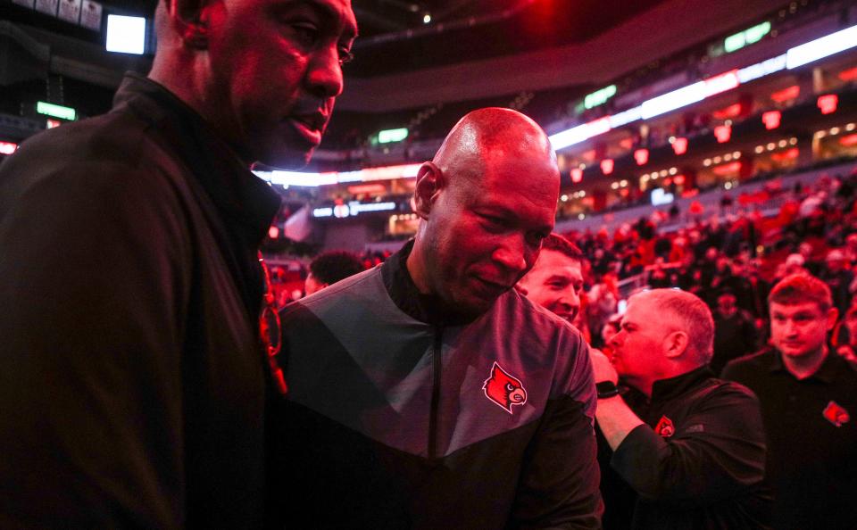 Louisville head coach Kenny Payne walks off the court after he and the Cards get their first win of the season as the Cards beat WKU 94-83 at the Yum! Center in downtown Louisville Wednesday night. Dec. 14, 2022