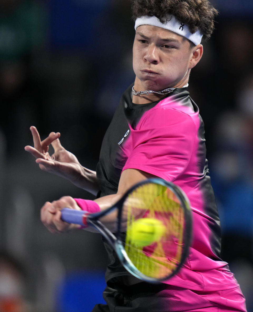 Ben Shelton of the U.S. hits a forehand return to Aslan Karatsev of Russia during the men's singles final of Japan Open tennis championships in Tokyo, Japan, Sunday, Oct. 22, 2023.(AP Photo/Shuji Kajiyama)