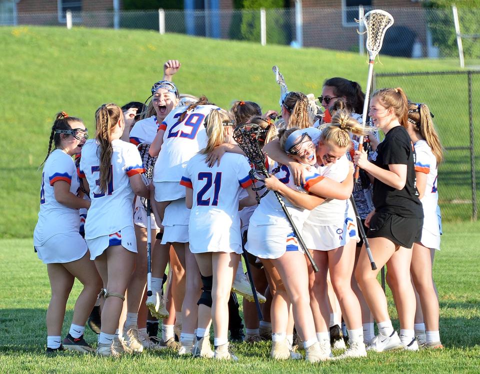 Boonsboro's girls lacrosse team celebrates after defeating Smithsburg 13-8 for the Class 1A West Region II title on May 16.