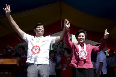 Presidential candidate Senator Miriam Defensor-Santiago with Vice-President candidate Senator Ferdinand "Bongbong" Marcos, son of late dictator Ferdinand Marcos gestures during a campaign rally at Batac town, Ilocos Norte, north of Manila, February 9, 2016. REUTERS/Czar Dancel