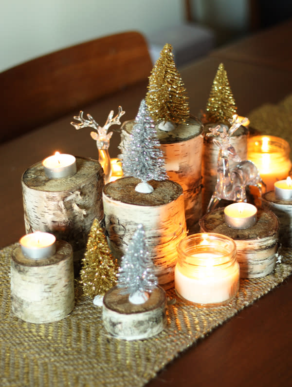Create a impressive centrepiece by using wood blocks of different heights and decorating with candles and glittery decorations.