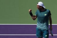 Mar 21, 2018; Key Biscayne, FL, USA; Joao Sousa celebrates after winning the first set against Ryan Harrison of the United States (not pictured) of on day two of the Miami Open at Tennis Center at Crandon Park. Sousa won 7-6(4), 7-6(4). Geoff Burke-USA TODAY Sports