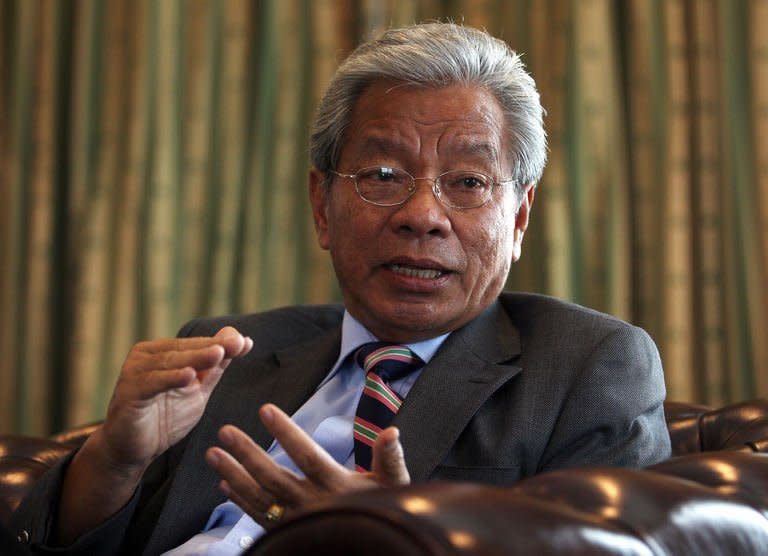 Ministry of Land Development Sarawak, James Masing, speaks during an interview at his office in Kuching, the capital city of Malaysia's Sarawak state, on February 8, 2013. Masing said the government would not push ahead with controversial plans to build 12 dams on Borneo island, after outrage from local tribes and environmentalists