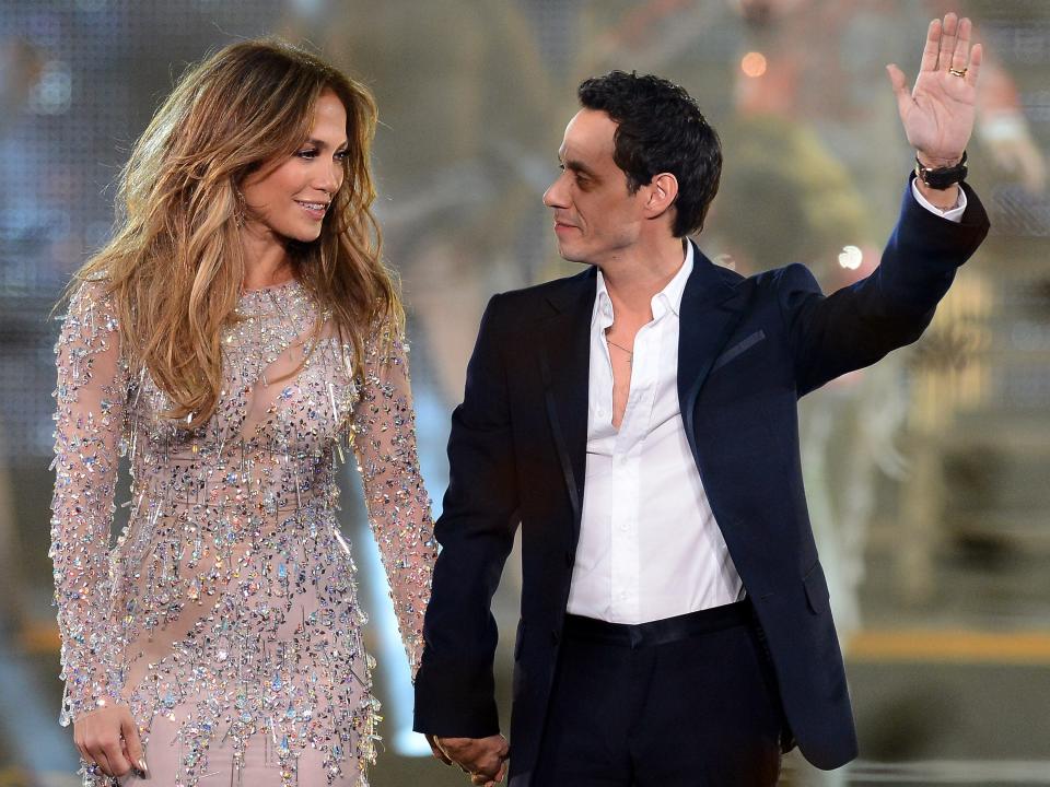 Singer/actress Jennifer Lopez (L) and singer Marc Anthony appear during the finale of the Q'Viva!
