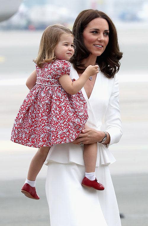 Charlotte even attempted a wave as the family made their way across the tarmac!