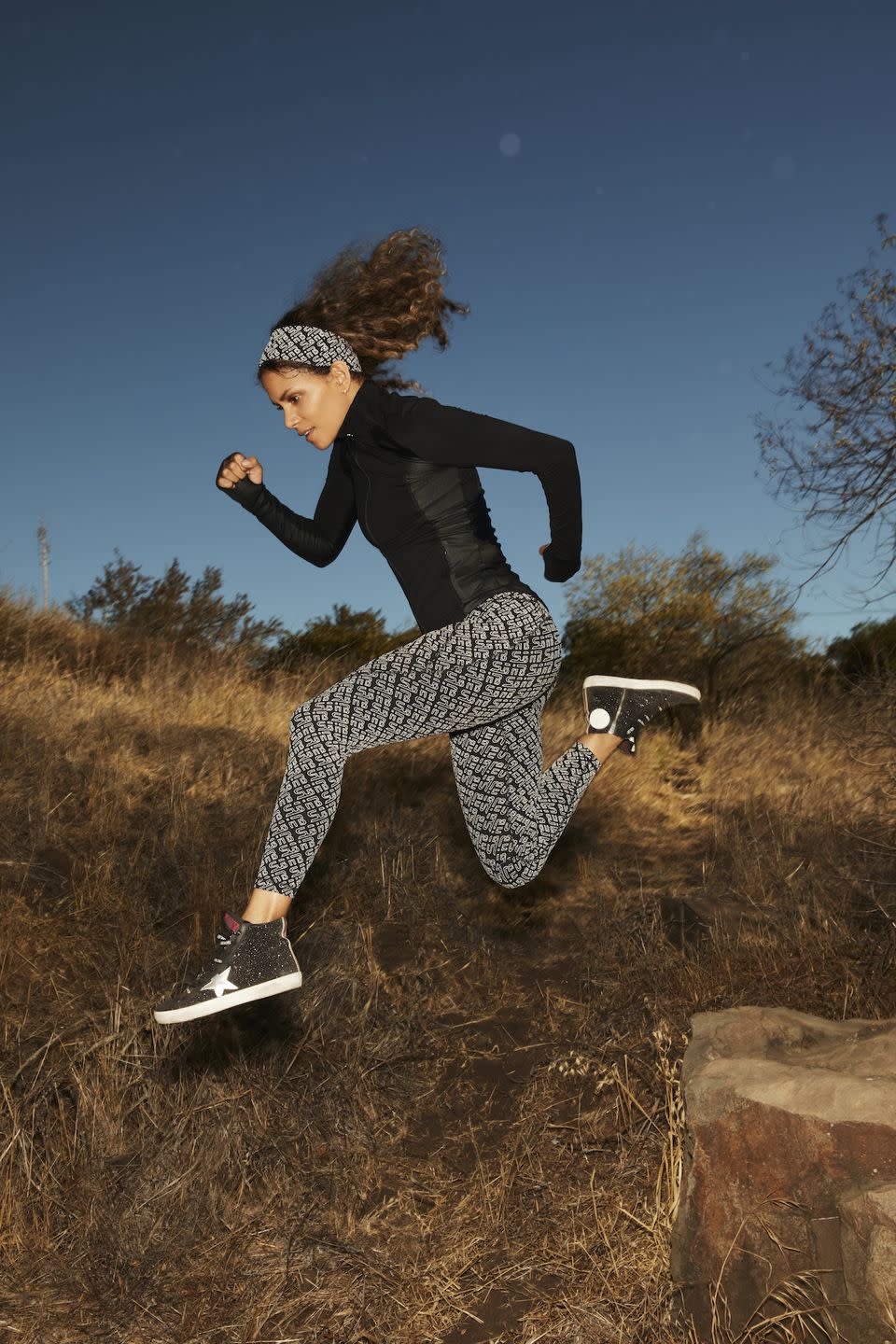 <p>Winter running kit: sorted. This sweat-wicking top has zip pockets for your keys and hand thumb holes to keep your sleeves from riding up. We're loving the legging print, too.</p><p><strong>How much?</strong> </p><p>Jacket, £95</p><p><a class="link " href="https://www.sweatybetty.com/halle-berry/halle-berry-edit/storm-power-high-shine-zip-through-jacket-SB7375_Black.html?cgid=halle-berry-edit&dwvar_SB7375__Black_color=black&tile=12.0#start=12" rel="nofollow noopener" target="_blank" data-ylk="slk:SHOP NOW;elm:context_link;itc:0;sec:content-canvas">SHOP NOW</a></p><p>Leggings, £75</p><p><a class="link " href="https://www.sweatybetty.com/halle-berry/halle-berry-edit/jinx-power-reflective-7-8-gym-leggings-SB7230R_BlackSBHBReflectivePrint_78Length.html?cgid=halle-berry-edit&dwvar_SB7230R__BlackSBHBReflectivePrint__78Length_color=blacksbhbreflectiveprint&dwvar_SB7230R__BlackSBHBReflectivePrint__78Length_leg-length=78length&tile=1.0#start=1" rel="nofollow noopener" target="_blank" data-ylk="slk:SHOP NOW;elm:context_link;itc:0;sec:content-canvas">SHOP NOW</a></p>