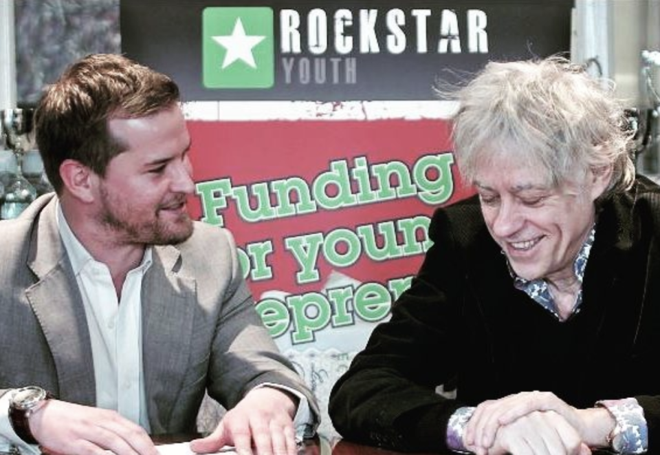 Jon Pfahl (left) engaging with Bob Geldof at a Rockstar event.