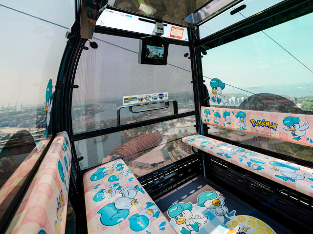 The cable car interior decked with pictures of Quaxly.