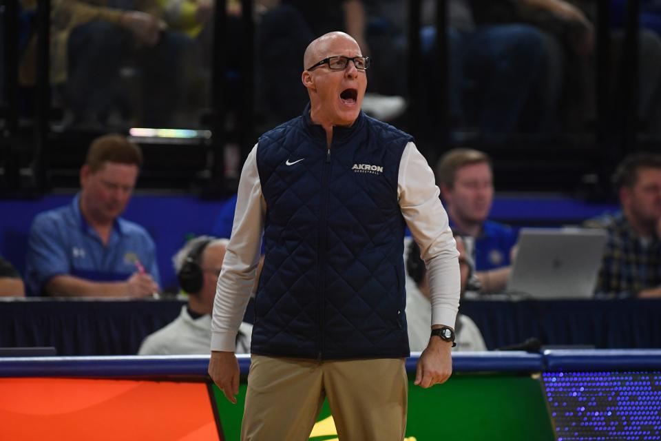 Akron head coach John Groce yells out to his team during a game at South Dakota State on Monday.